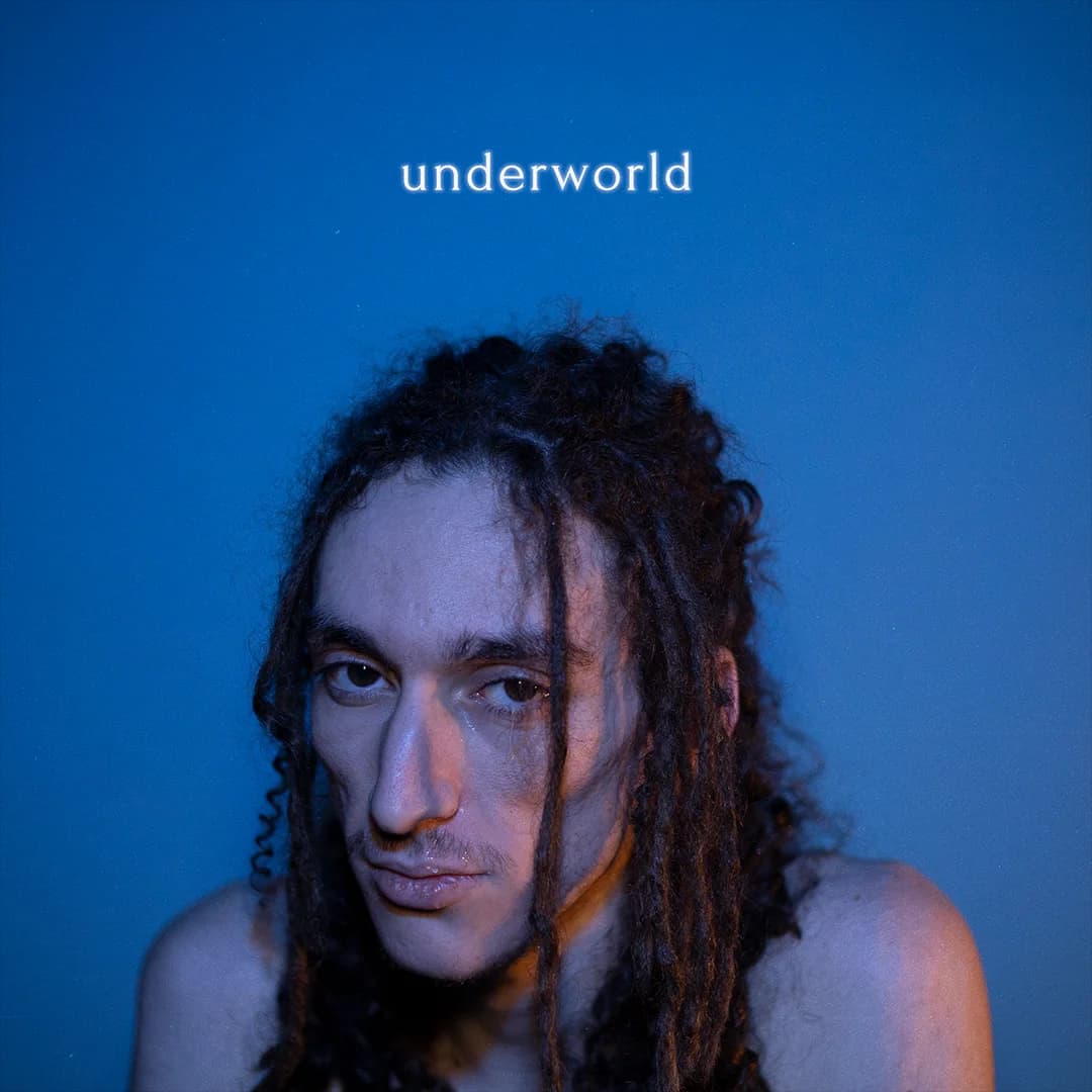 Underworld cover: a portrait against blue